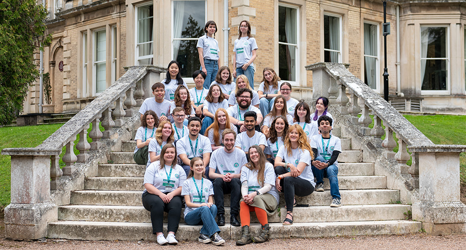 Residence Life Team sitting on some steps